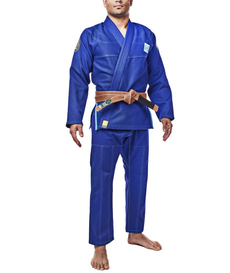A man poses in a blue Hypnotik gi, the Vortex V2 BJJ.