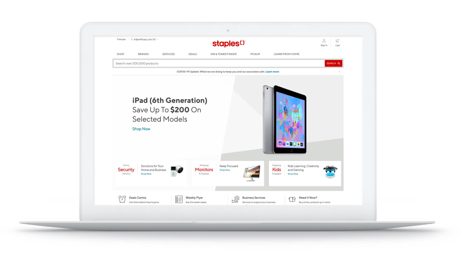 The Staples website on a laptop.