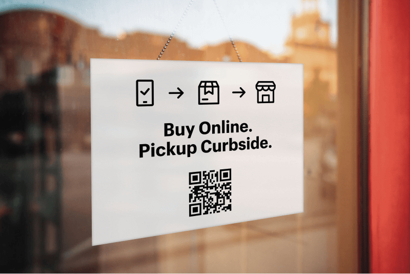 Window with a poster that says `Open Online` with a QR code below the title.